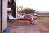 Aero Boero 115, PP-GKB, "Condor", do Aero-clube de Araraquara, sendo empurrado para dentro do seu hangar. (19/08/2006)