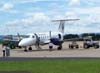 Embraer EMB-120ER, PP-PSB, da Passaredo, companhia area de Ribeiro Preto, desembarcando os passageiros e as bagagens e sendo reabastecido. (29/12/2006)