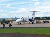 Embraer EMB-120ER, PP-PSB, da Passaredo, companhia area de Ribeiro Preto, aguardando o embarque dos passageiros e das bagagens. (29/12/2006)