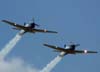 Dois Embraer T-27 Tucano (nmero 3, FAB 1327, e nmero 5, FAB 1360), da Esquadrilha da Fumaa fazendo uma passagem sobre o aeroporto. (04/10/2007)