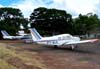 Em primeiro plano, o Piper/Neiva EMB-711C Corisco, PT-NJL, e atrs dele, o Cessna 172E, PT-CDO, com a pintura da Air France na cauda, aeronave utilizada na gravao do ltimo captulo da novela Roque Santeiro, da Rede Globo, em 1986.