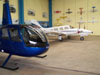 Robinson R44 em primeiro plano e um Seneca logo atrs.