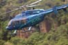 Bell 407, PT-YZL, da Pro-Fly, logo aps a decolagem de um heliponto na Praia dos Mangues, em Ilha Grande, Rio de Janeiro. (12/10/2006)
