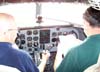 Os comandantes norte-americanos Doug, a esquerda, e John Papas, realizando a longa check-list do Douglas DC-3 "Rose", N101KC, estacionado ao lado da torre de controle do aeroporto de So Carlos. (30/08/2007)