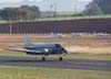 Douglas DC-3 "Rose", N101KC, durante o pouso no aeroporto de So Carlos. Atrs dele, v-se,  partir da esquerda, um Cirrus SR-22, um Cessna 150J (PT-AKY, da Mariano Escola de Aviao) e um Piper/Embraer Tupi (PT-NXW, tambm da Mariano Escola de Aviao), estacionados no ptio da aviao geral, em frente ao terminal de passageiros.  (31/08/2007)